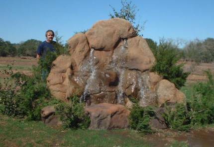 Jim standing beside the Grande Falls precast rockscape