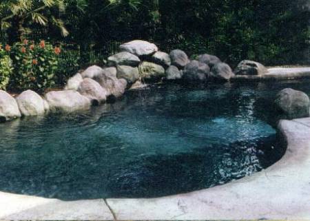 Lagoon pool with lightweight, hollow frc boulders and waterfall.